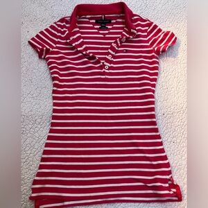 Im selling this Tommy Hilfiger shirt it is xxs its short sleeve, pink and white